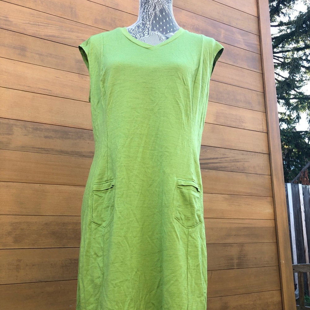 Cute apple green Ibex dress with pockets and lovely graphic design on back.